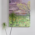 Colorful Mosaic Artwork on White Wall with Vibrant Patterns and Palm Plants