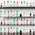 Various Colorful Wine Bottles Neatly Arranged On Multiple Wall Shelves With Different Shapes And Sizes