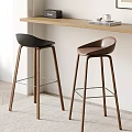 Stylish Black And Brown Bar Stools With Wooden Legs And Kitchen Countertop