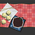 Bowl of Red Soup with White Dumplings and Chopsticks on Red Checkered Cloth