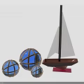 Decorative Furniture Pieces With Three Blue Spherical Decorations And Brown Sailboat Model