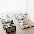 Stylish Decorative Accessories Set on Wooden Table with Magazines Vintage Radio Glass Carafe and Cups