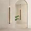 Black Tiered Cone Pendant Lights Near Archway With Neutral Wall And Green Plant