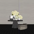 Modern Black Console Table with Yellow Hydrangeas Books and Beige Ottoman on White Wall