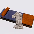 Modern Ottoman With Blue Orange Upholstery Pillow Checkered Blanket And Metal Legs