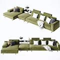 Modern Green Sectional Sofa With Multiple Pillows And Throw Blanket 3d model