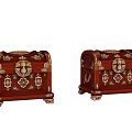 Pair of Red Treasure Chests With Gold Decorative Accents And Intricate Carvings