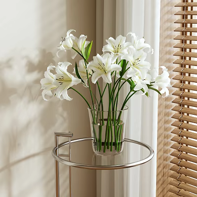 White Lilies Arranged In Clear Glass Vase On Metal Round Side Table With Natural Light 3d model