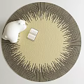 Round Rug With Cream Center Black Sunburst Pattern White Polar Bear Figurine Open Book