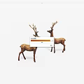 Two Decorative Deer Figurines With Antlers Standing As Ornamental Statues