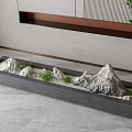 Indoor Decorative Mountain Sculpture Carving In Gray Rectangular Container With Small Green Plants 3d model