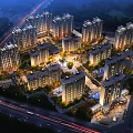 Aerial Planning of Modern Residential Complex with High Rise Buildings Night Lighting Roads and Greenery