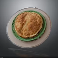 Delicious Baked Pie With Golden Crust Served On Green Plate And White Base