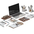 Laptop With Office Supplies Notebook Mouse Pens And Papers On Workspace