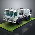 White Heavy Duty Off Road Vehicle with Large Tires on Green Platform