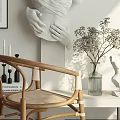 Wooden Frame Cane Leisure Chair in Stylish Minimalist Interior with Natural Light and Vase Sculpture