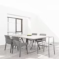 Modern Dining Table Set With Wooden Top Four Black Chairs Magazine And Fruit Bowl