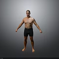 Shirtless Man Wearing Black Shorts Standing Barefoot Against Gray Background