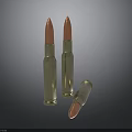 Three Military Bullets with Golden Casings Red Tips and Reflective Surface