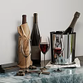 Elegant Wine Bottles And Glasses Arrangement On Marble Countertop With Ice Bucket