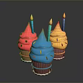 Colorful Cupcakes with Pink Blue Yellow Frosting Lit Candles and Sprinkles on Shiny Black Background