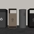 Four Varied Colored Recycling Bins With Sorting Symbols On Modern Countertop