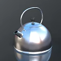 Silver Metal Kettle With Modern Design Curved Handle And Smooth Reflective Surface