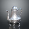 Silver Hammered Teapot With Lid Handle Spout And Three Legged Base