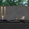 Dark Stone Scenic Wall With Water Pool Fire Pit White Chair And Green Plants Background