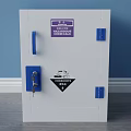 White Corrosive Safety Storage Cabinet With Blue Handles And Class 8 Label