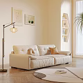 Modern Beige Two Seater Sofa In Living Room With Throw Pillows And Floor Lamp