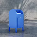 Blue Commercial Equipment With Mail Slot And Door On Paved Ground Against Gray Brick Wall