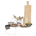 Wooden Cutting Boards Spoons Brushes And Bread On Kitchen Counter With Olive Oil Bottle