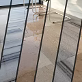 Glass Partition Components with Black Metal Frame Light Marble Tile Floor and Reflections