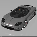 Silver Convertible Sports Car With Sleek Aerodynamic Design And Red Brake Calipers