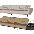 Modern Three Seater Sofa with Light Beige and Brown Cushions Side Table Lamp and Books