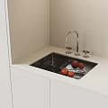 Kitchen Sink with Running Water and Tomatoes on White Cabinet Countertop