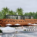 Boat Shaped Guesthouse Building Surrounded By Palm Trees With Outdoor Seating And Umbrellas