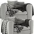 Modern Cozy Gray Velvet Accent Chair with Soft Pillows and Plaid Blanket in Living Room
