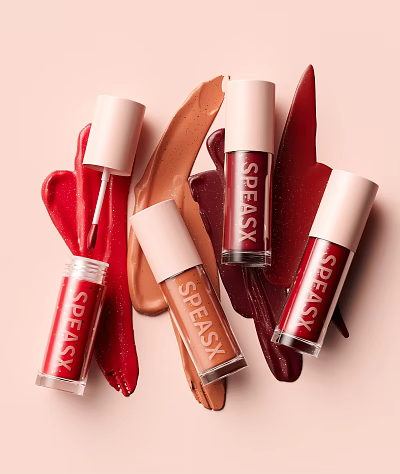 SPEASK Lip Gloss Cosmetic Products With Red Brown Shades On Pastel Pink Background 3d model