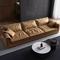 Modern Three Seater Tan Leather Sofa With Plush Cushions And Round Coffee Table