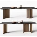 Modern Dining Table With Black Marble Top And Brass Metal Legs And Decorative Bowls