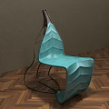 Teal Leaf Shaped Outdoor Chair With Black Metal Frame And Modern Design