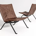 Two Brown Leather Leisure Chairs With Black Metal Frames And Modern Minimalist Design
