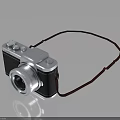 Classic Design Digital Camera With Silver Black Body And Red Strap On Black Background