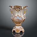 Exquisitely Carved Ceramic Vase With Golden Accents Cherubs And Architectural Design