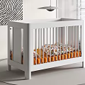 White Baby Crib with Floral Bedding and Orange Mattress in Modern Nursery Room