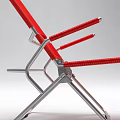 Red Foldable Lounge Chair With Metal Frame And Striped Mesh Design
