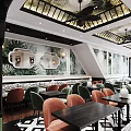 Elegant Modern Restaurant Interior With Stylish Tables Chairs Ceiling Lights And Decorative Wall Art