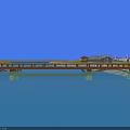 Scenic Landscape Bridge with Blue Water Stone Shore Green Grass Trees Pavilions Red White Lighthouses